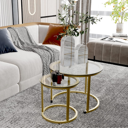 Modern round nesting coffee tables with gold metal frame and clear glass top