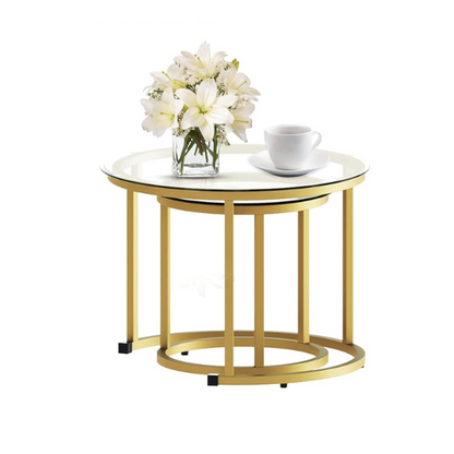 Modern round nesting coffee tables with gold metal frame and clear glass top