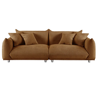 Modern rust brown upholstered sofa with deep seating and chrome-finished legs, featuring 4 matching accent pillows for a warm, stylish living room.