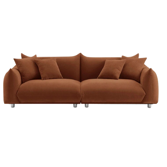 Modern rust upholstered sofa with deep seating and chrome-finished legs, featuring 4 matching accent pillows, perfect for contemporary living rooms.