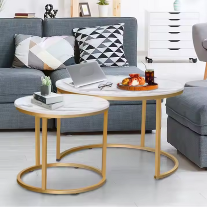 Modern white round nesting coffee tables with marble handles and metal frame for contemporary living room.