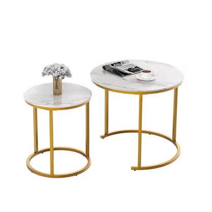 Modern white round nesting coffee tables with marble handles and metal frame for contemporary living room.