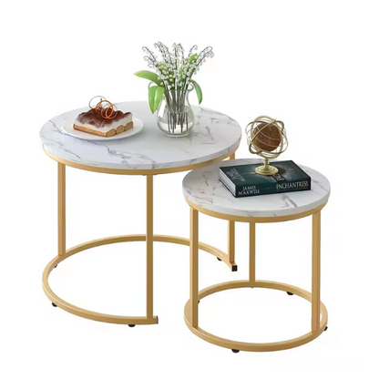 Modern white round nesting coffee tables with marble handles and metal frame for contemporary living room.