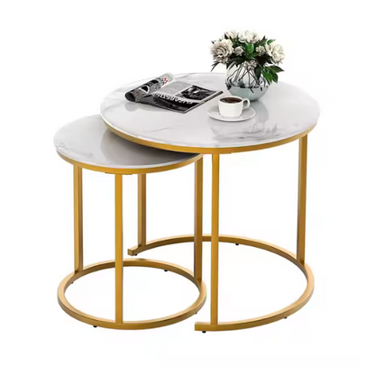 Modern white round nesting coffee tables with marble handles and metal frame for contemporary living room.
