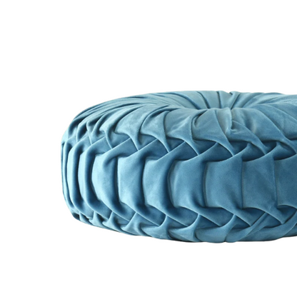 Muted blue velvet round throw pillows with pleated detailing and button center, 14.5-inch set of two styled on a neutral-toned sofa.

