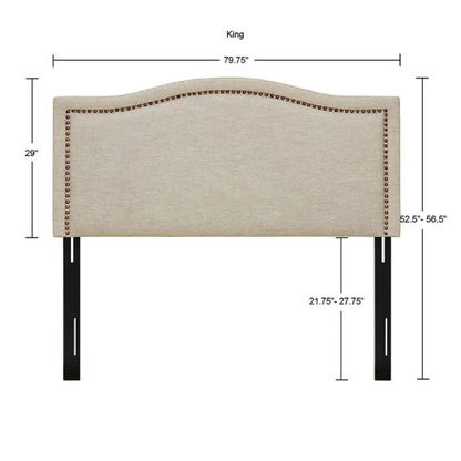 Natural beige upholstered king headboard with curved silhouette, silver nailhead trim, and adjustable metal legs for bed frame mounting

