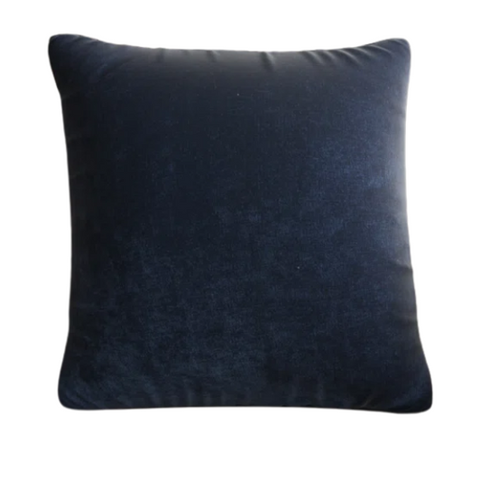 Navy blue crushed velvet throw pillow, square 16x16 design with soft texture and reversible cover, styled on a modern sofa for cozy, elegant home decor.

