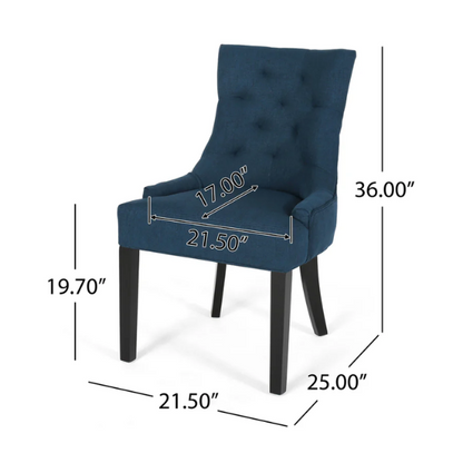 Set of four navy blue upholstered dining chairs featuring diamond tufted backs, armless design, sloped sides, and espresso brown wooden legs.


