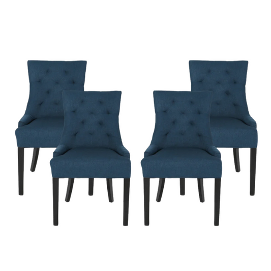 Set of four navy blue upholstered dining chairs featuring diamond tufted backs, armless design, sloped sides, and espresso brown wooden legs.


