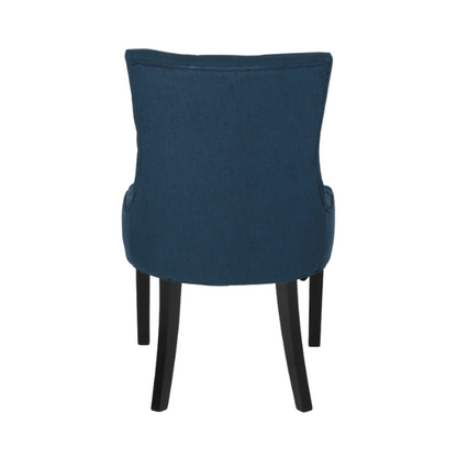 Set of four navy blue upholstered dining chairs featuring diamond tufted backs, armless design, sloped sides, and espresso brown wooden legs.

