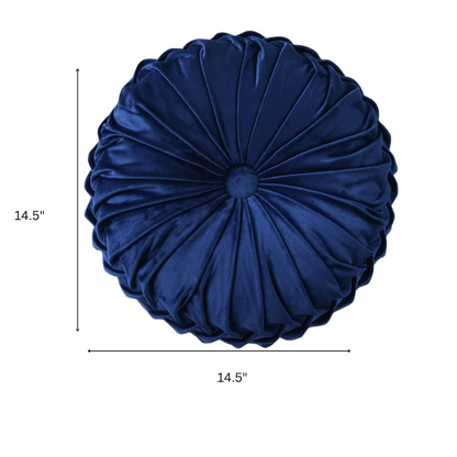 Navy blue velvet round throw pillows with hand-sewn pleats and button center, 14.5-inch set of two styled on a neutral-toned sofa.

