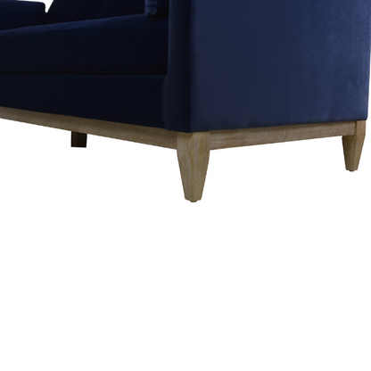 Navy blue velvet 3-seater sofa with feather-down cushions, track arms, and solid wood legs, designed for modern and transitional interiors.

