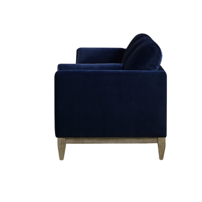 Navy blue velvet 3-seater sofa with feather-down cushions, track arms, and solid wood legs, designed for modern and transitional interiors.

