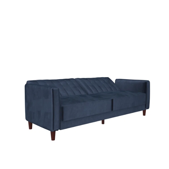 Navy blue velvet convertible sofa with vertical tufting, square arms, and brown tapered legs, designed with a split-back reclining feature and twin bed conversion.