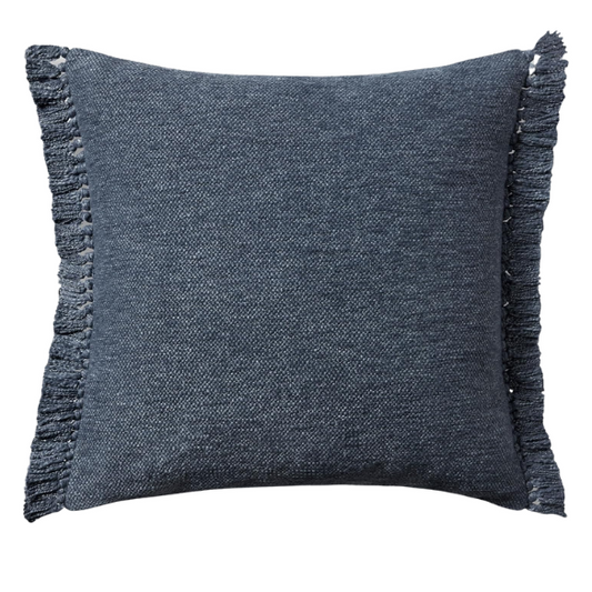 Navy cotton blend throw pillow with fringe, 22x22 square decorative cushion styled on a neutral sofa for bold, modern interior decor.

