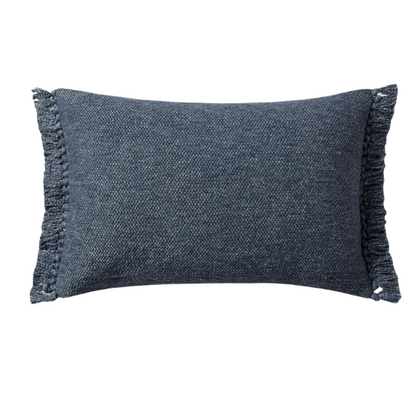 Navy lumbar throw pillow with fringe, rectangular 13x21 design, cotton blend fabric, styled on a modern sofa for cozy interior decor.

