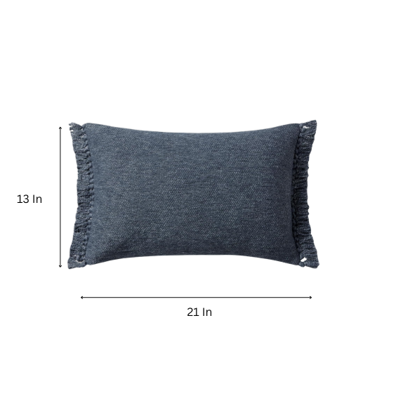Navy lumbar throw pillow with fringe, rectangular 13x21 design, cotton blend fabric, styled on a modern sofa for cozy interior decor.

