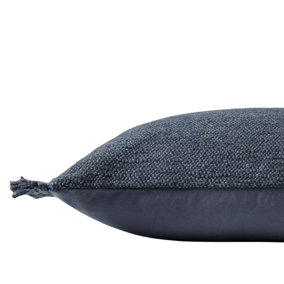 Navy lumbar throw pillow with fringe, rectangular 13x21 design, cotton blend fabric, styled on a modern sofa for cozy interior decor.


