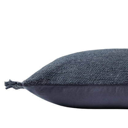 Navy lumbar throw pillow with fringe, rectangular 13x21 design, cotton blend fabric, styled on a modern sofa for cozy interior decor.

