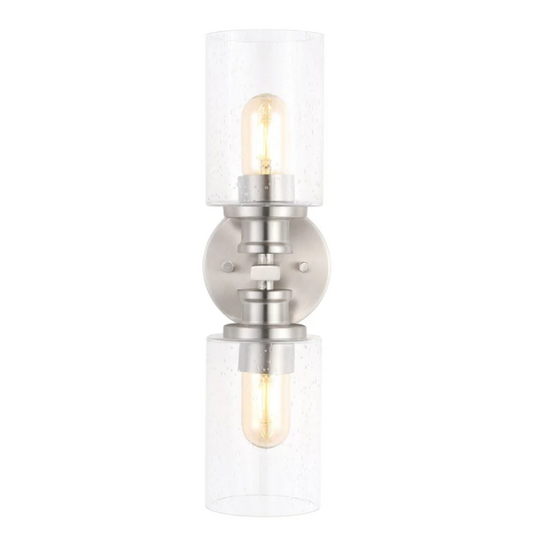 Brushed nickel wall sconce with two clear seeded glass cylinder shades and Edison-style LED bulbs, perfect for bathrooms or hallway accent lighting

