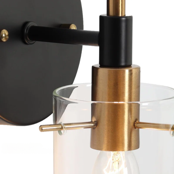 Nordic modern wall sconce with matte black finish, electroplated brass arm, and clear cylindrical glass shade – stylish uplight or downlight fixture


