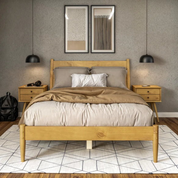 Full-size mid-century platform bed in natural oak finish with tapered legs and rectangular headboard