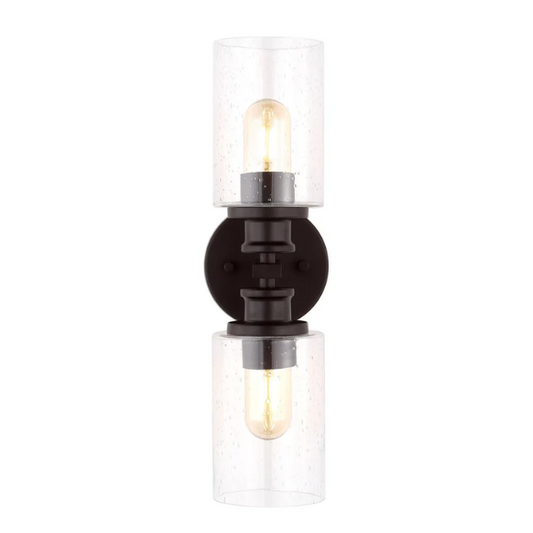 Oil-rubbed bronze wall sconce with dual clear seeded glass cylinder shades and Edison-style LED bulbs, perfect for rustic, farmhouse, or traditional interiors

