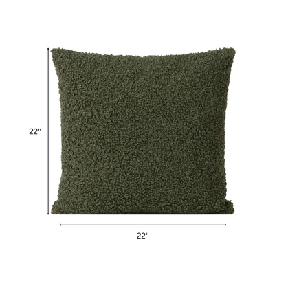 Olive drab bouclé throw pillow with textured loop fabric, square accent pillow on neutral sofa


