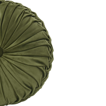 Olive green velvet round throw pillows with hand-pleated detailing and button center, styled on a beige sofa for a warm, inviting look.

