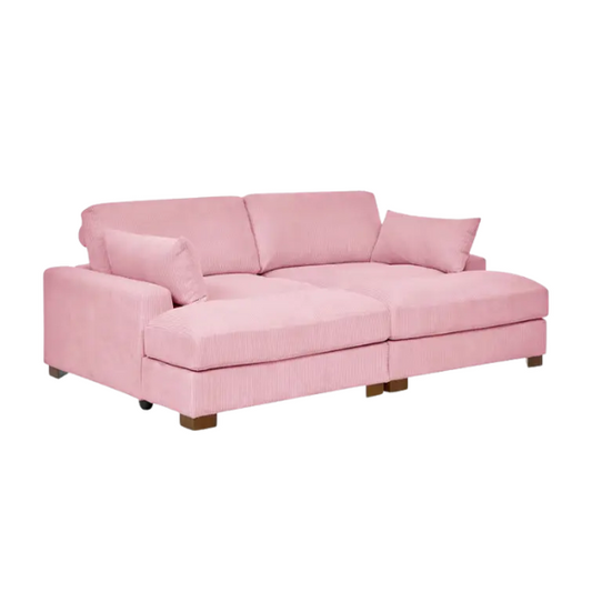 Pink corduroy convertible sleeper sofa with adjustable headrest, twin bed functionality, and mid-century wood legs
