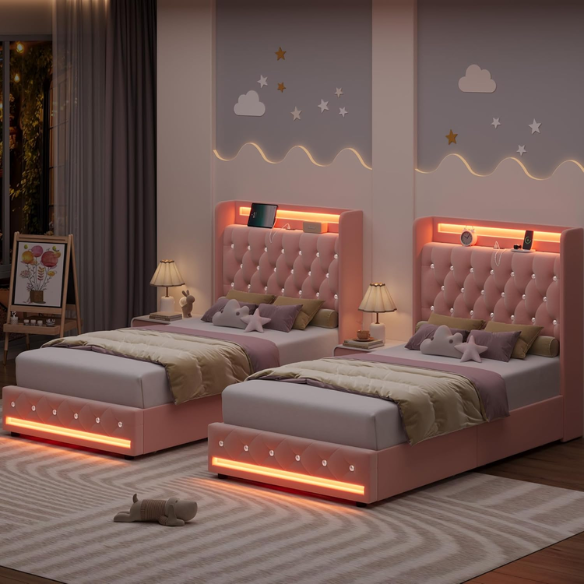 Pink velvet twin bed with LED-lit tufted headboard, crystal buttons, USB charging ports, and underbed storage drawers
