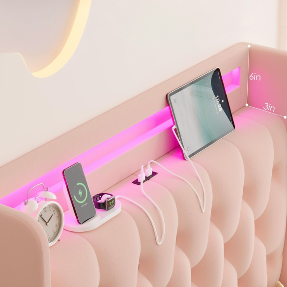 Pink velvet twin bed with LED-lit tufted headboard, crystal buttons, USB charging ports, and underbed storage drawers