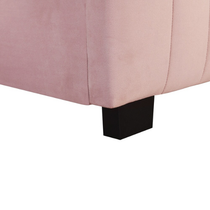 Pink twin upholstered platform bed with tufted velvet headboard and pull-out trundle, designed for kids, teens, or guest rooms, featuring a soft pink finish and space-saving design.

