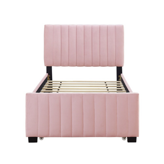 Pink twin upholstered platform bed with tufted velvet headboard and pull-out trundle, designed for kids, teens, or guest rooms, featuring a soft pink finish and space-saving design.

