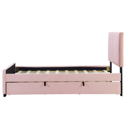 Pink twin upholstered platform bed with tufted velvet headboard and pull-out trundle, designed for kids, teens, or guest rooms, featuring a soft pink finish and space-saving design.

