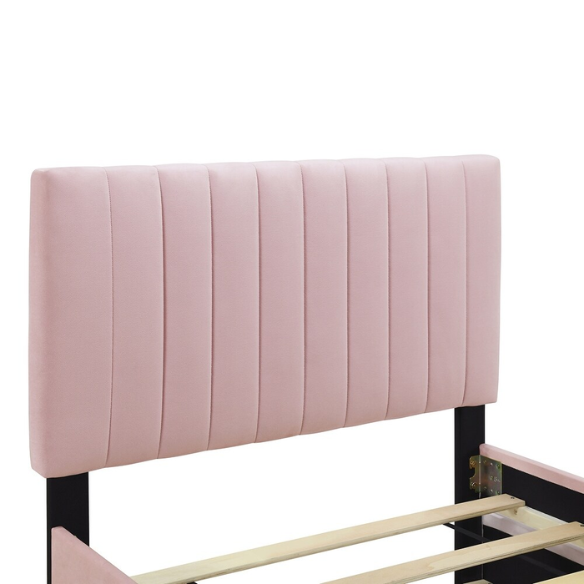 Pink twin upholstered platform bed with tufted velvet headboard and pull-out trundle, designed for kids, teens, or guest rooms, featuring a soft pink finish and space-saving design.

