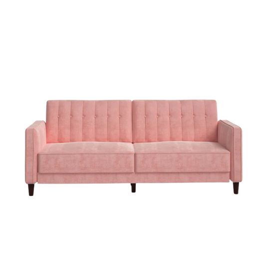 Pink velvet convertible sofa with tufted split-back design, square arms, and tapered brown wood legs, easily converting into a twin-size sleeper.