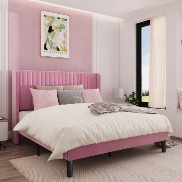 Pink full-size velvet upholstered platform bed with tufted wingback headboard and wood slats