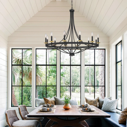 40-inch wagon wheel chandelier in aged zinc and satin brass finish with 12 candle-style lights, ideal for high ceilings in traditional or modern interiors


