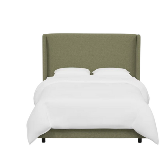 Avocado green king-size upholstered bed in linen fabric with wingback headboard and low-profile black metal legs.

