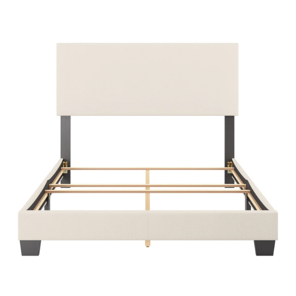 Beige full-size upholstered bed with a high rectangular bouclé headboard, cushioned frame, and clean modern lines, shown in a neutral-toned bedroom.

