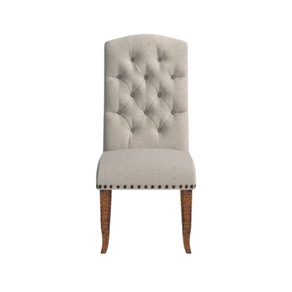 Set of 2 beige button-tufted farmhouse dining chairs with rustic wood legs, nailhead trim, and upholstered linen-like fabric.

