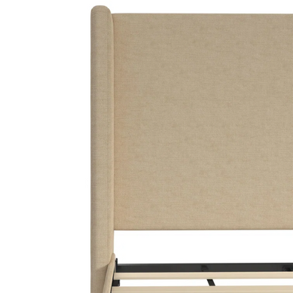 Beige canvas queen bed with tall wingback headboard and black conical legs, styled in a modern bedroom setting.

