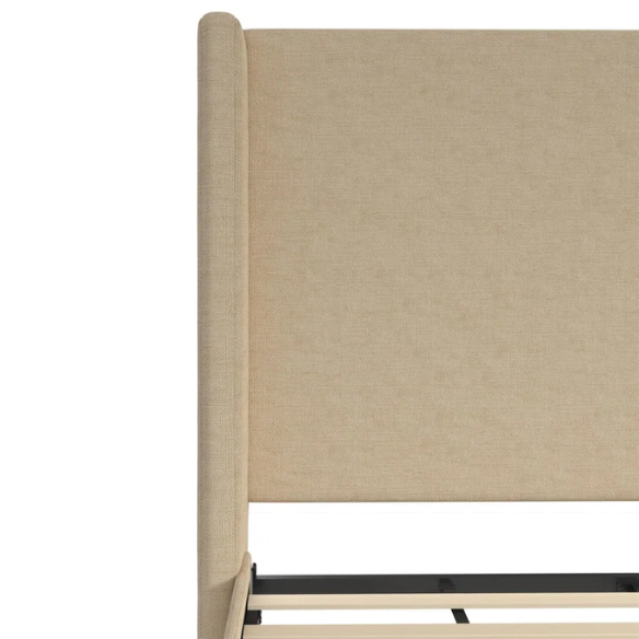 Beige canvas queen bed with tall wingback headboard and black conical legs, styled in a modern bedroom setting.

