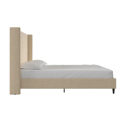 Beige canvas queen bed with tall wingback headboard and black conical legs, styled in a modern bedroom setting.

