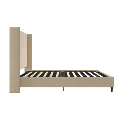 Beige canvas queen bed with tall wingback headboard and black conical legs, styled in a modern bedroom setting.

