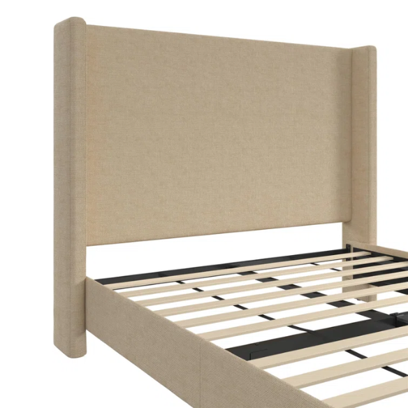 Beige canvas queen bed with tall wingback headboard and black conical legs, styled in a modern bedroom setting.

