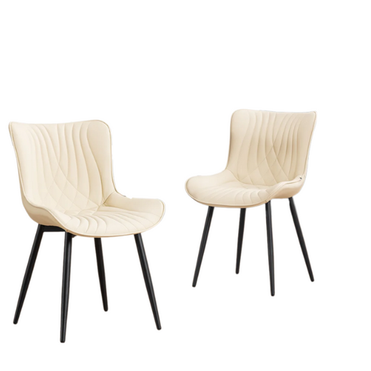Set of 2 beige faux leather dining chairs with modern fishtail backrest and black metal legs, designed for contemporary dining spaces.

