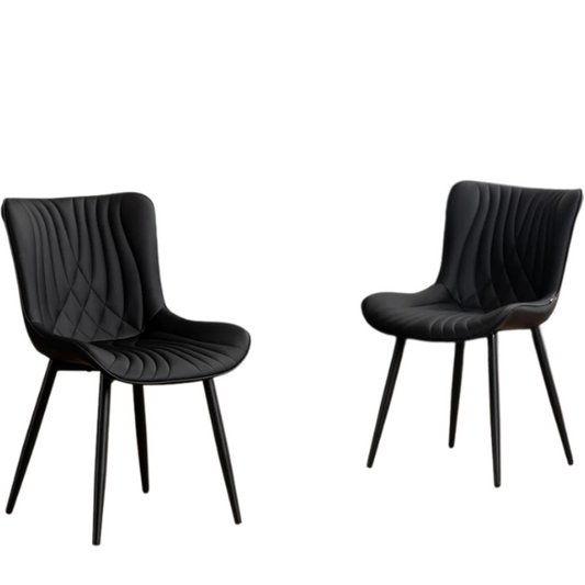 Set of 2 black faux leather dining chairs with fishtail backrest design and black metal legs, ideal for modern and contemporary dining spaces.

