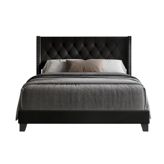 Black queen-size bed with faux leather upholstery, tufted wingback headboard, nailhead trim, and low-profile wood frame.

